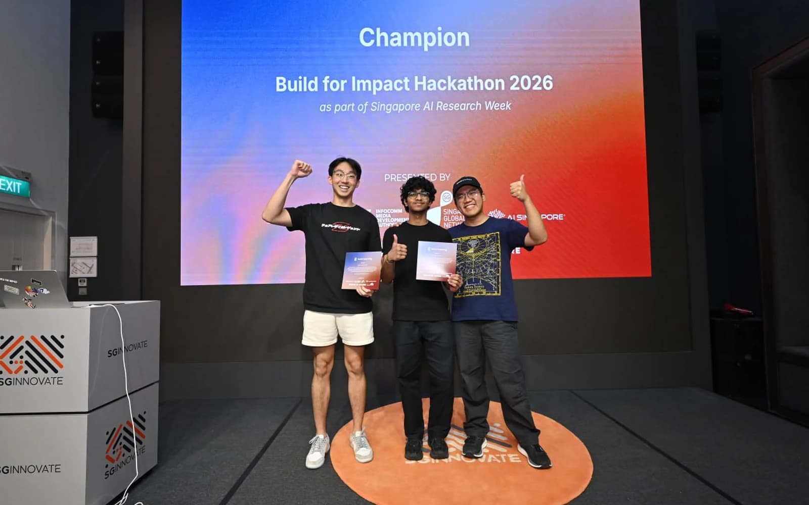 Abhishek on the Build for Impact champion podium